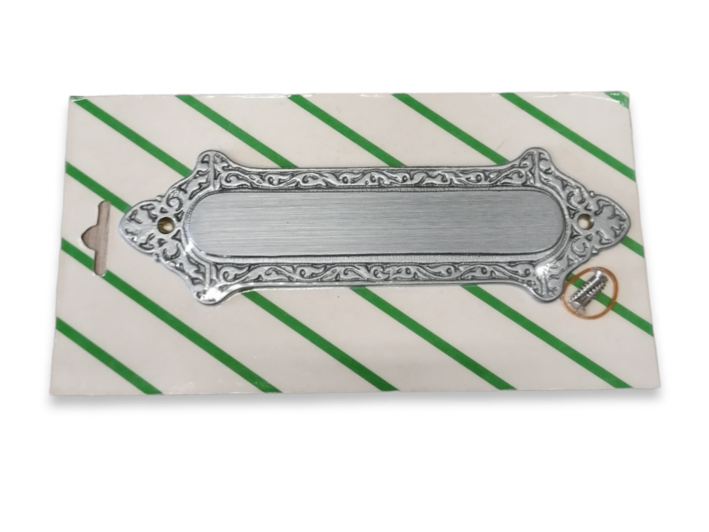 Koristeellinen messinkikyltti